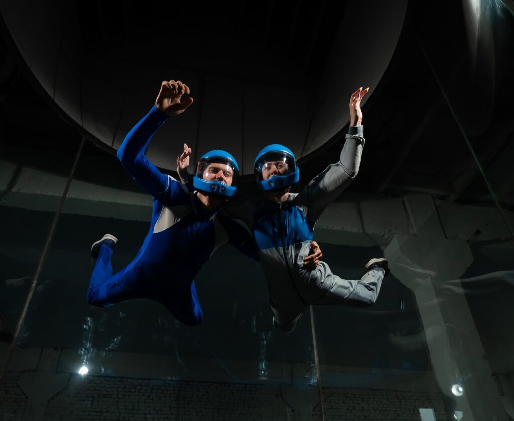 Athlete in a blue suit flying in the wind tunnel