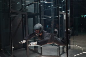 Wind tunnel flight wearing a safety helmet